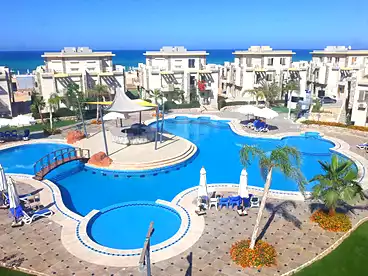 Chalet with Garden For sale in Cecilia Lagoons Resort - Ibn Sina S.A.E, North Coast Resorts, 100 sqm